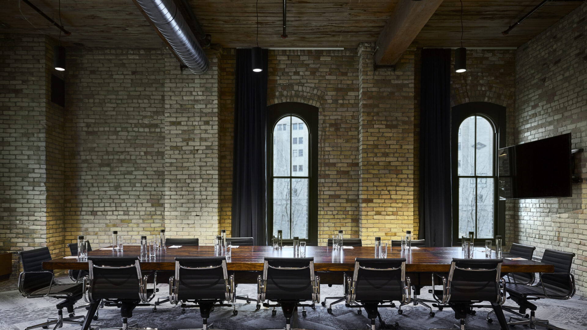 Conference table with rolling chairs in our Minneapolis event space