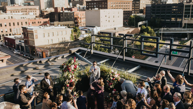 Crowd of people enjoying a wedding on our hotel's downtown Minneapolis rooftop