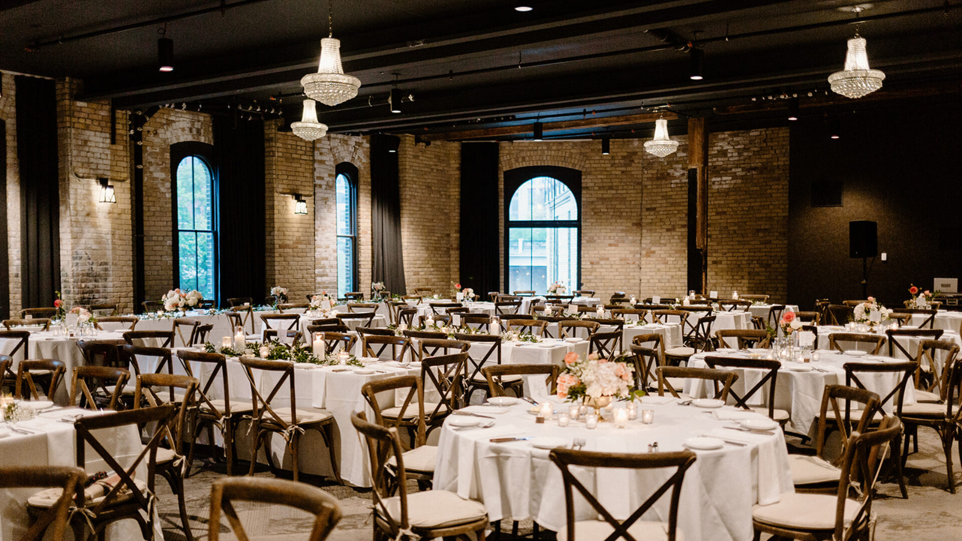 Brick wedding space at our hotel in downtown MPLS with banquet tables