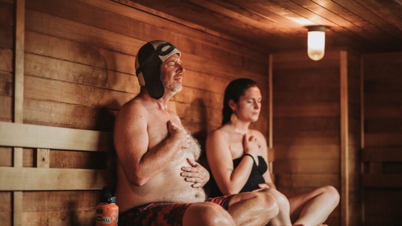 Man and woman with eyes closed enjoying our sauna in Minneapolis, MN